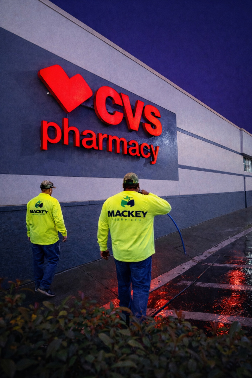 Mackey team power washing the exterior of a pharmacy